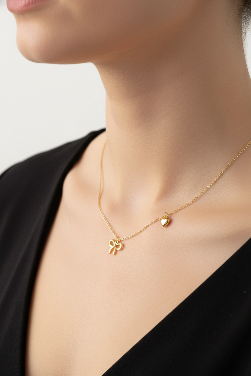 GOLD BOW AND HEART NECKLACE