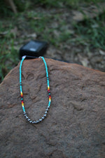 0209 TURQ SEED BEAD NL W/ 6MM FRONT SILVER BEADS