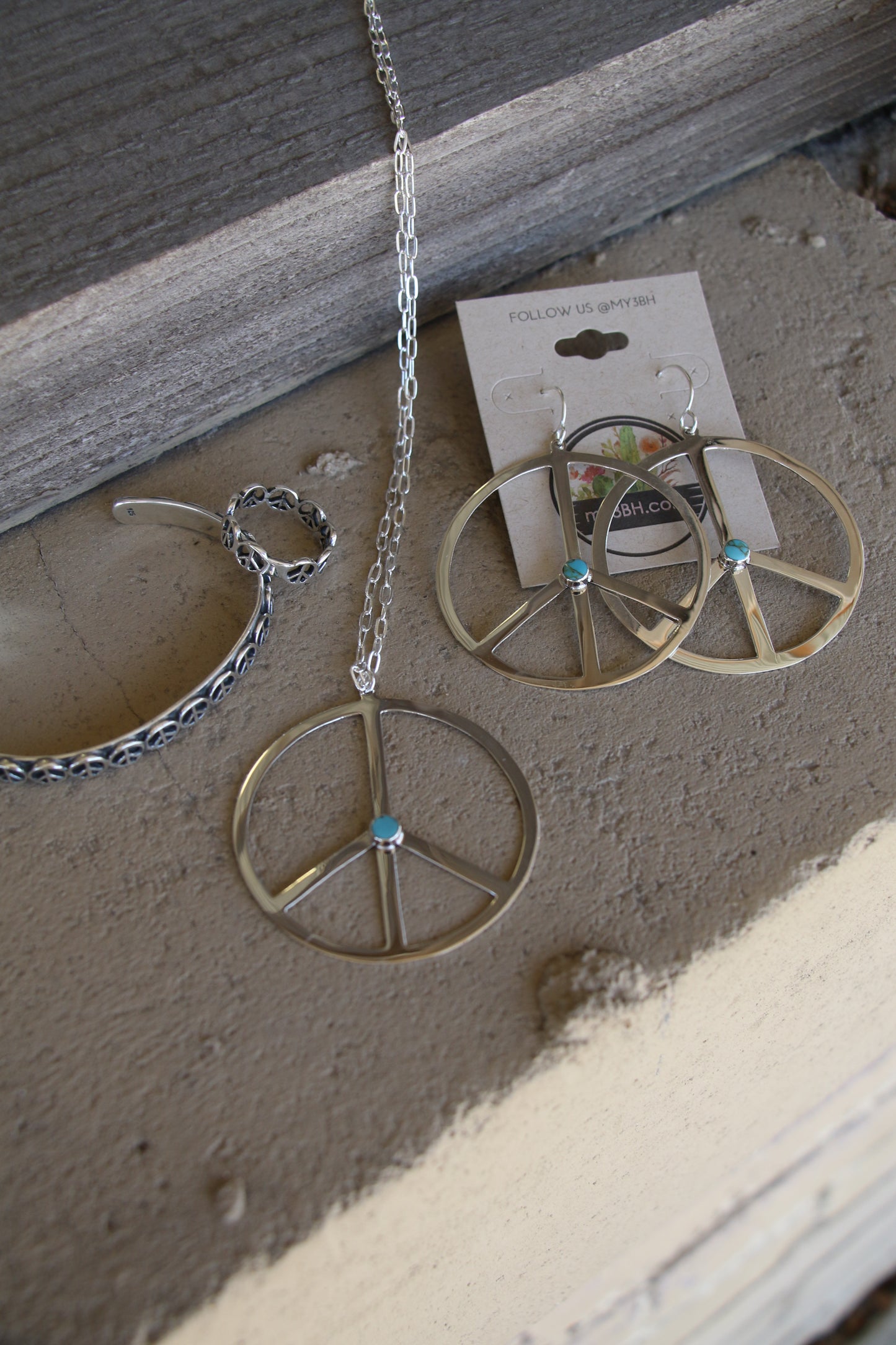 1239 -TQ SILVER PEACE EARRINGS