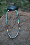 0209 TURQ SEED BEAD NL W/ 6MM FRONT SILVER BEADS