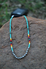0209 TURQ SEED BEAD NL W/ 6MM FRONT SILVER BEADS
